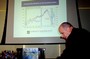 John, trying to adjust the economy... er, the projector.